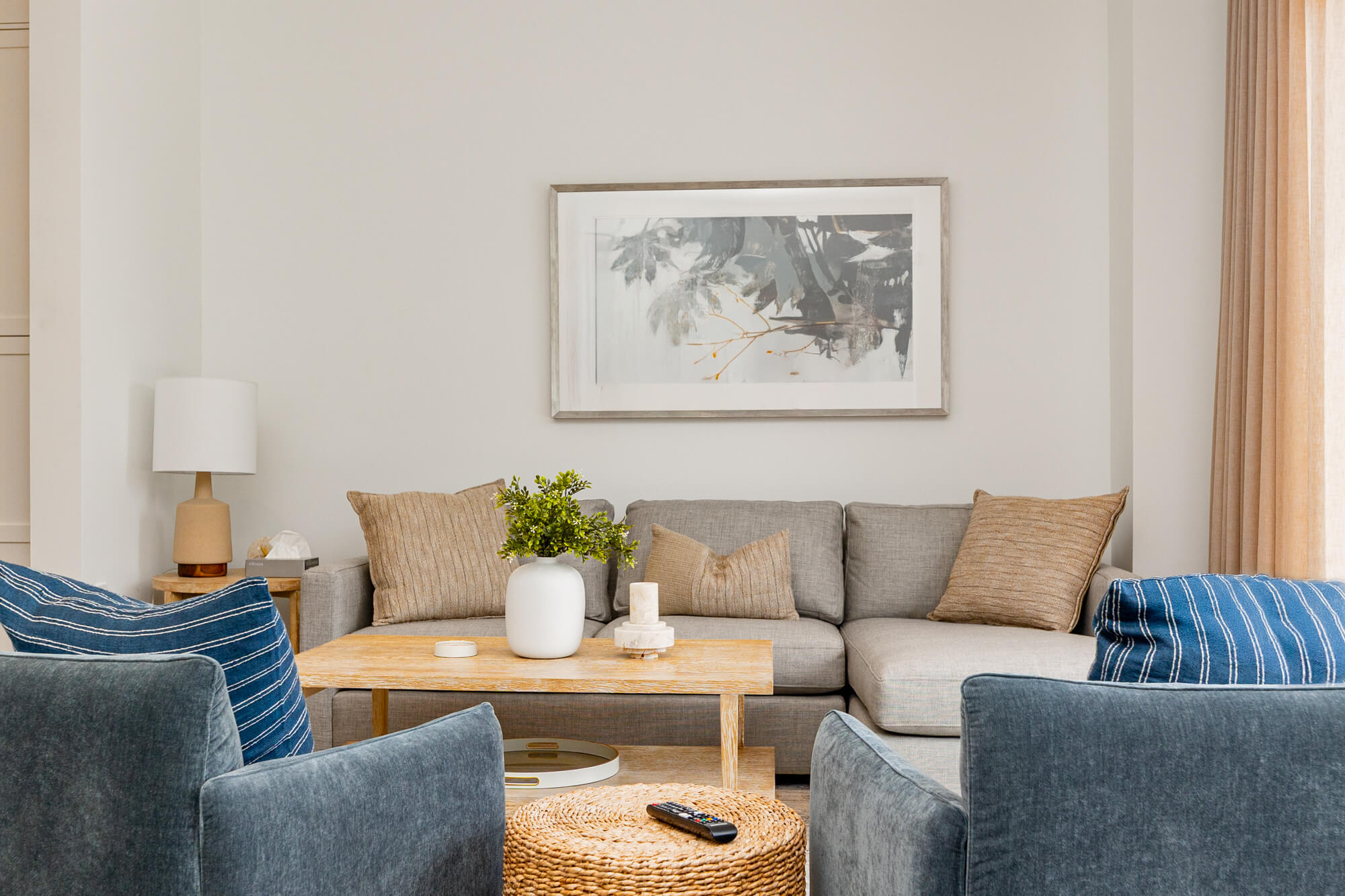 Cozy cottage Airbnb interior with comfortable seating, warm styling and inviting vacation rental atmosphere