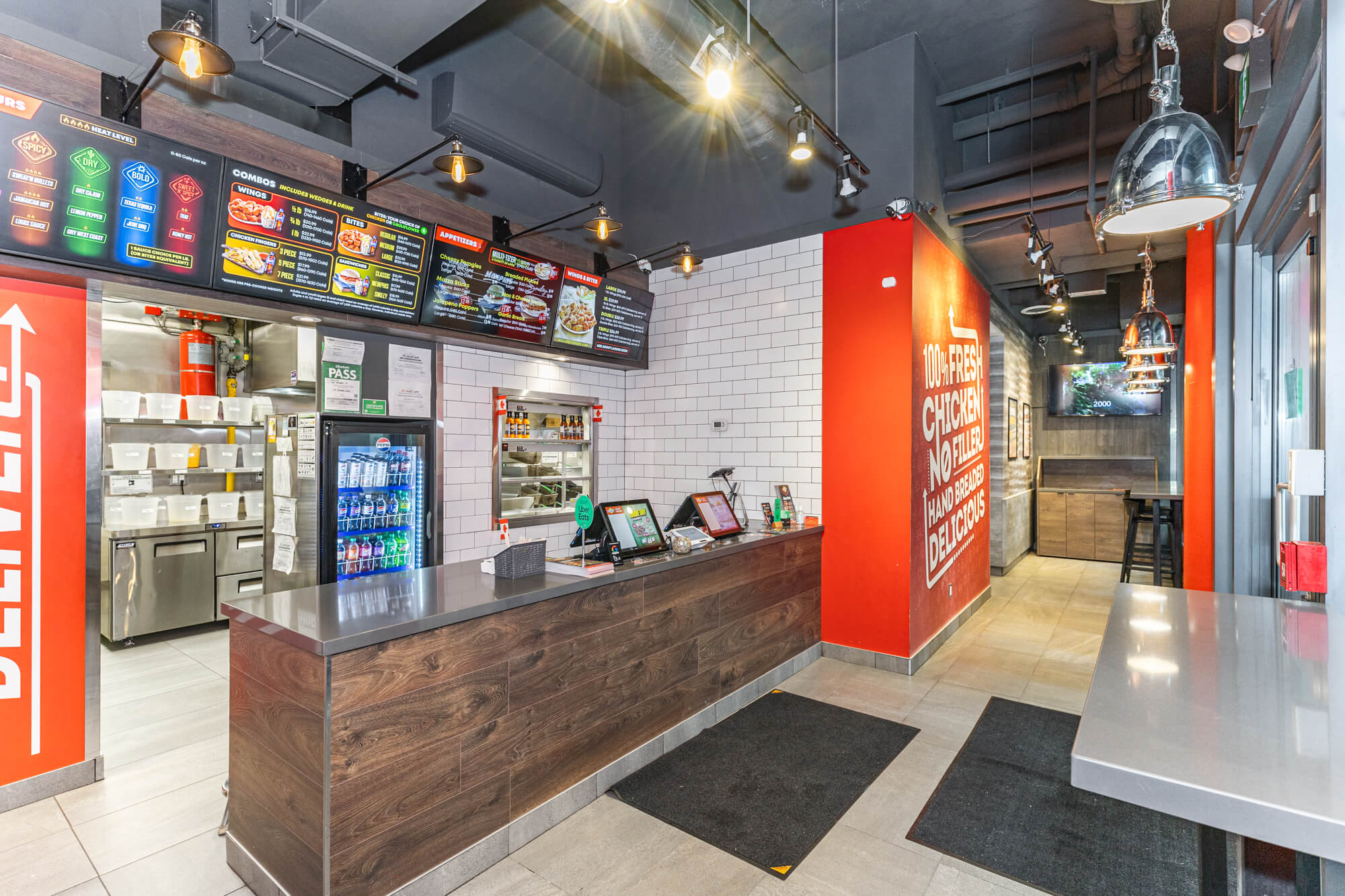 Quick-service restaurant photography in Toronto showing service counter and branded commercial space